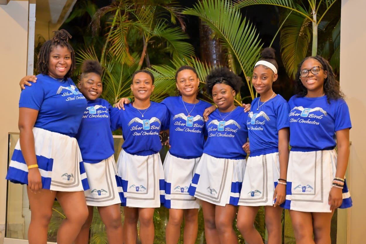 Close-up of sheet music resting on a steel pan drum.